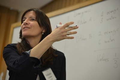 Fabiana Cardetti, associate professor of mathematics, works with teachers from three Connecticut school districts on issues related to math instruction for Common Core. (Shawn Kornegay/UConn Photo)